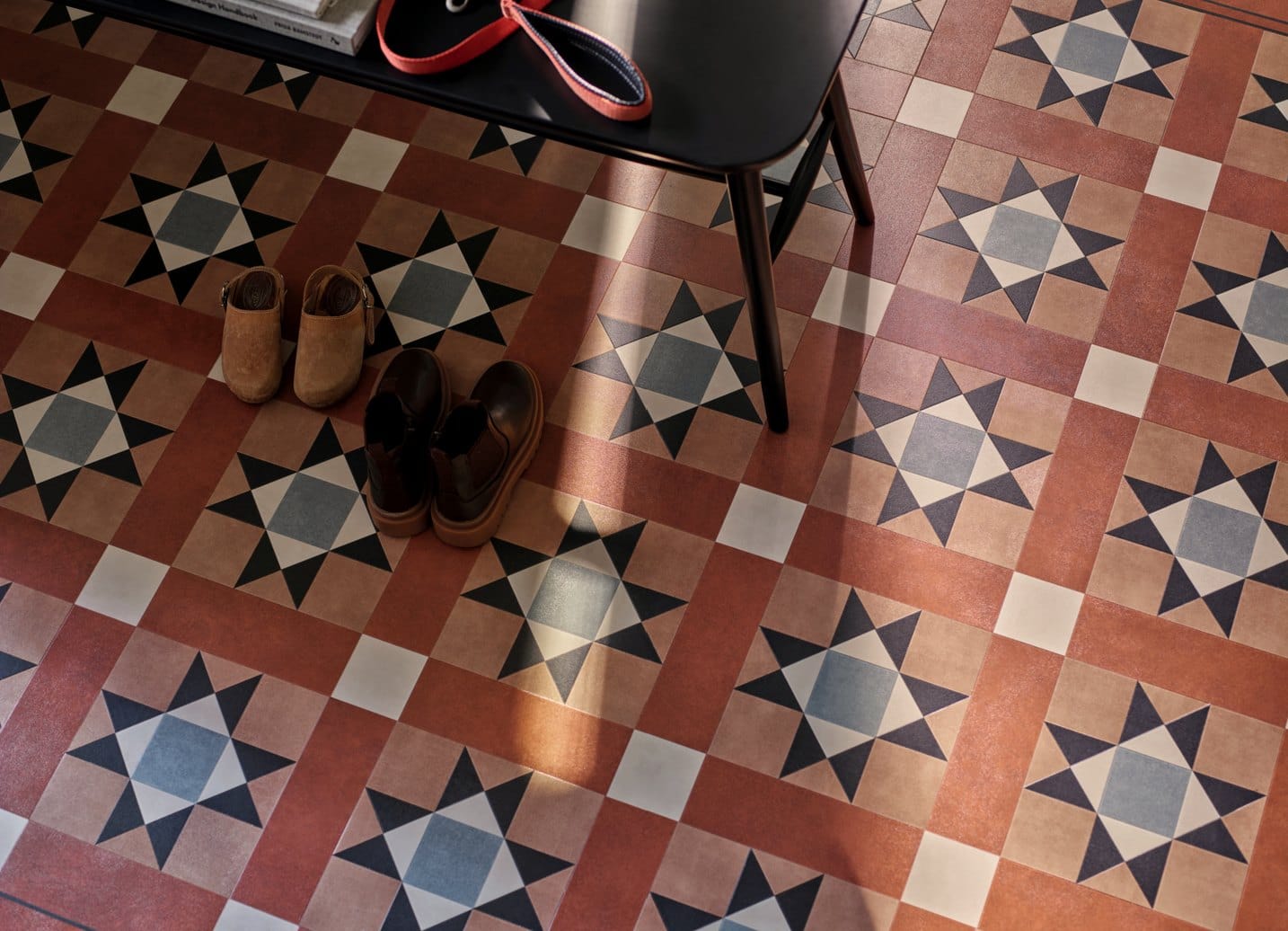 Amtico Décor geometric patterned floor in terracotta and blue